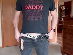Daddy strips to his jock,  butt plug and starts playing