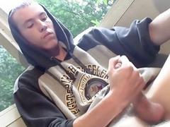 Homosexual thug takes a smoke outdoors and jacks off