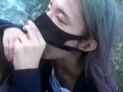 Masked Asian lovers playing out their sex fantasy outdoors