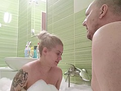 Hot blonde with big natural tits cleans his cock in the bathroom